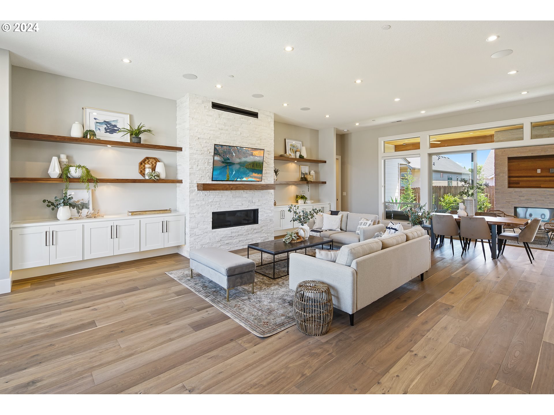 17711 Northeast 25th Avenue, Unit LOT 8 Ridgefield, WA 98642 - Photo 6 of 39 a living room with furniture and a wooden floor