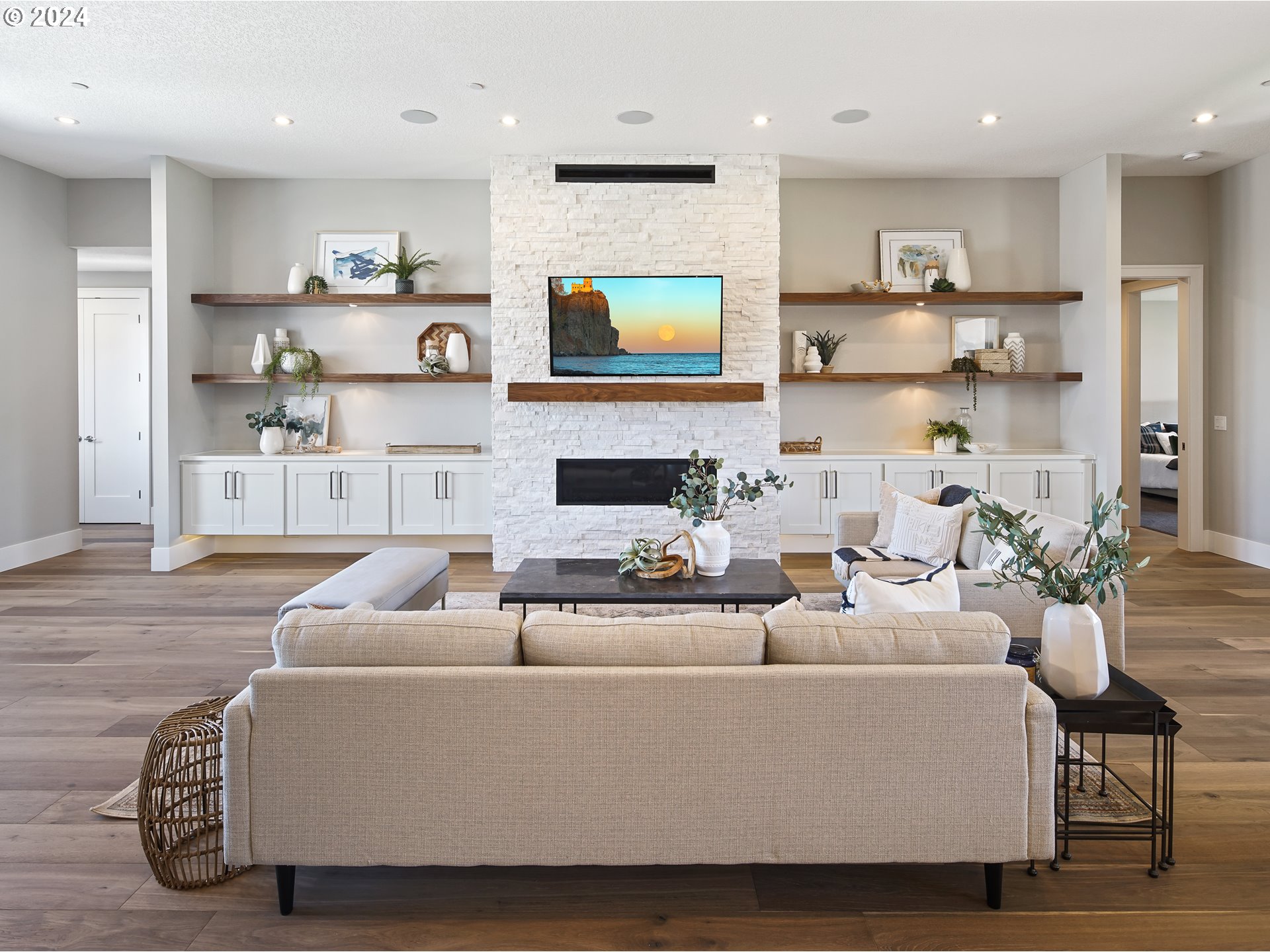 17711 Northeast 25th Avenue, Unit LOT 8 Ridgefield, WA 98642 - Photo 7 of 39 a living room with furniture a fireplace and a flat screen tv