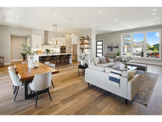 a living room with furniture and kitchen view