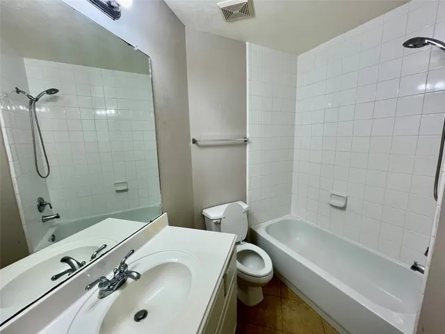 an empty room with closet area