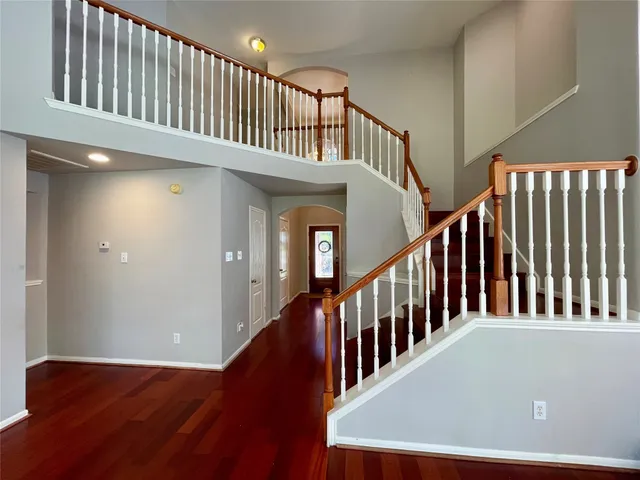 a view of staircase with lots of wooden floor