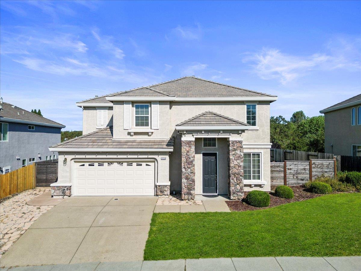 3134 Olympic Way Auburn, CA 95603 - Photo 1 of 1 a front view of a house with a yard and garage
