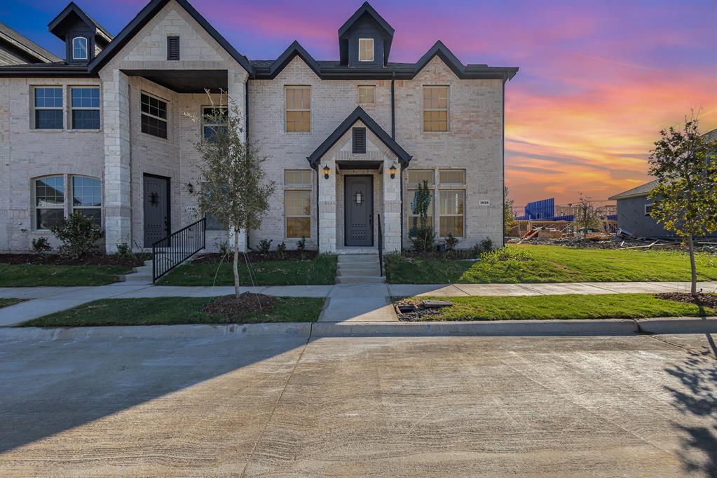 3628 Chaucer Trail Rowlett, TX 75088 - Photo 1 of 17 View of front facade featuring a lawn