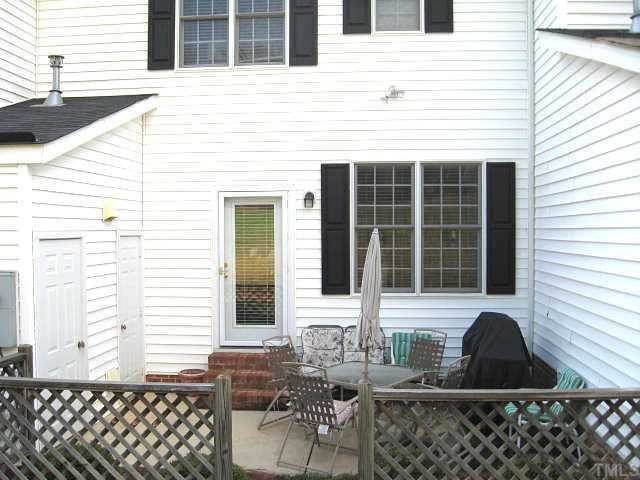 5406 Goldenglow Way Raleigh, NC 27606 - Photo 11 of 12 a front view of a house with outdoor seating