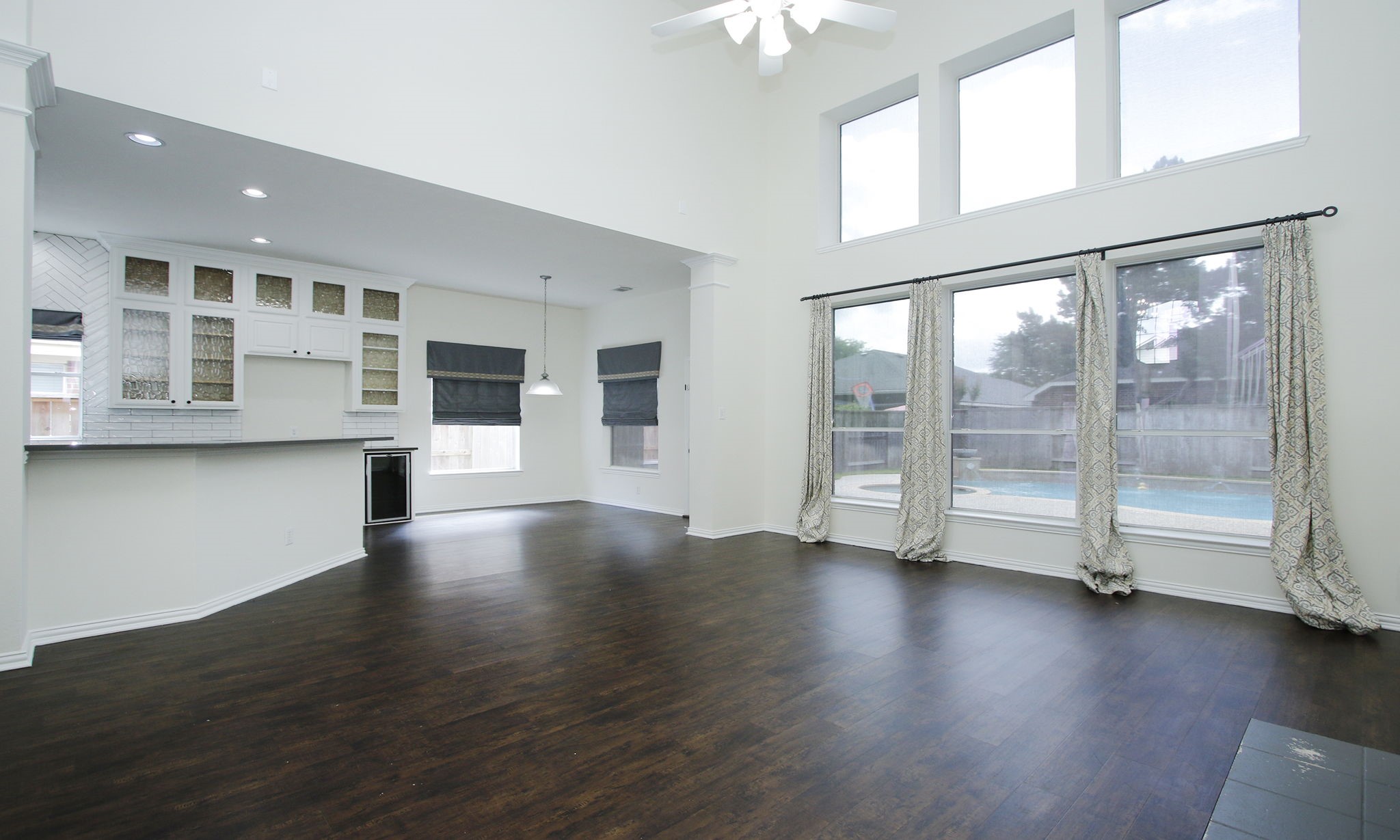 1210 Berwick Manor Court Spring, TX 77379 - Photo 21 of 50 an empty room with wooden floor and windows