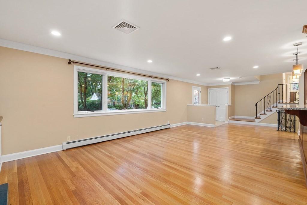 40 Helene Road Newton, MA 02468 - Photo 11 of 27 a view of an empty room with wooden floor and a window