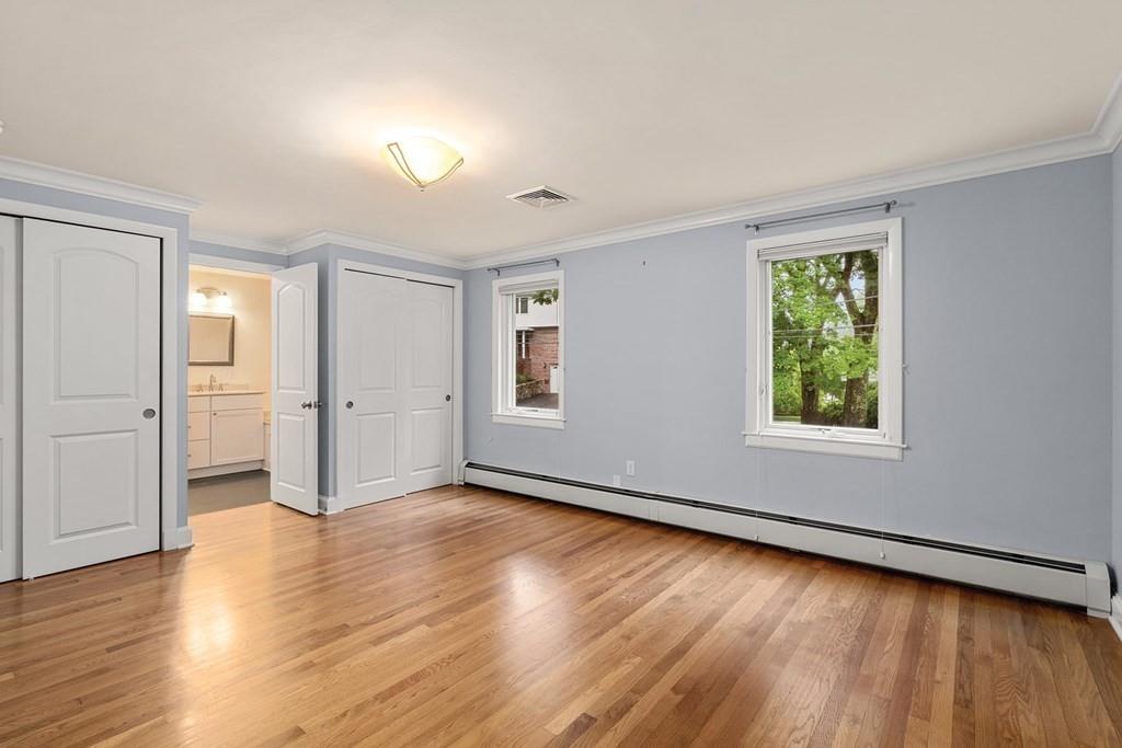 40 Helene Road Newton, MA 02468 - Photo 14 of 27 wooden floor in an empty room with a window