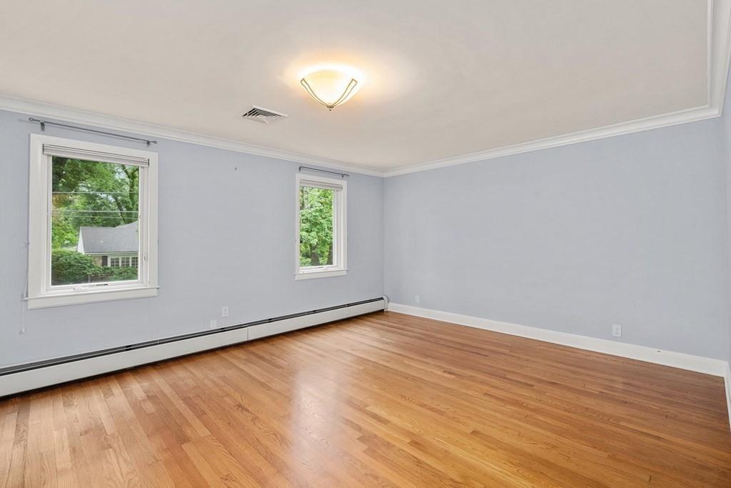 40 Helene Road Newton, MA 02468 - Photo 15 of 27 an empty room with wooden floor and windows