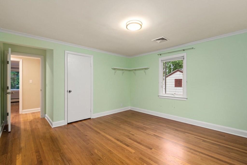 40 Helene Road Newton, MA 02468 - Photo 20 of 27 an empty room with wooden floor and windows