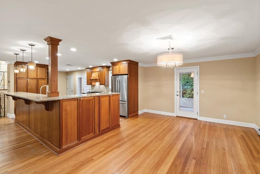 40 Helene Road Newton, MA 02468 - Photo 4 of 27 a view of a kitchen with wooden floor and staircase