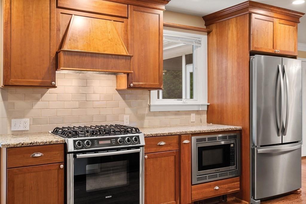 40 Helene Road Newton, MA 02468 - Photo 7 of 27 a kitchen with a stove and a refrigerator