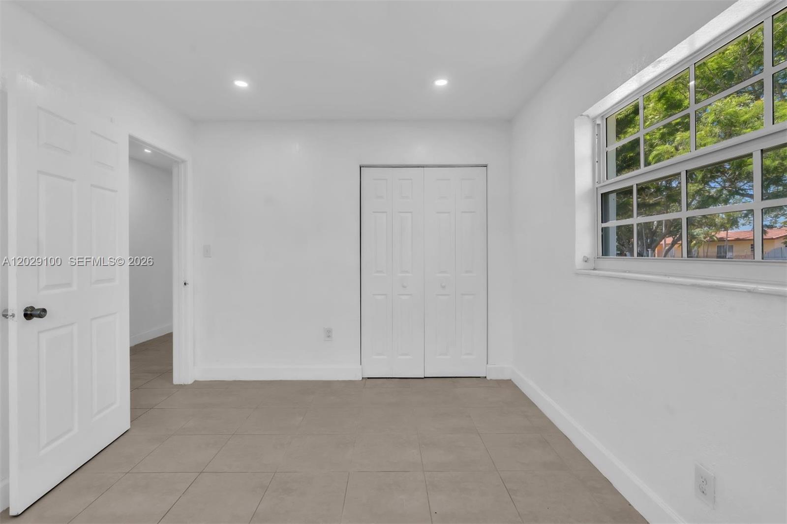 11790 Southwest 34th Street Miami, FL 33175 - Photo 34 of 56 an empty room with windows