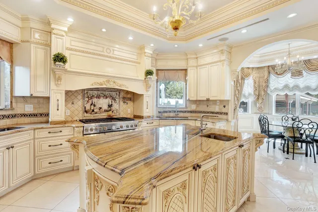 a kitchen with a stove a sink and a refrigerator