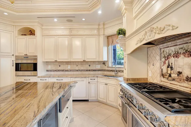 a kitchen with a stove a sink and a refrigerator