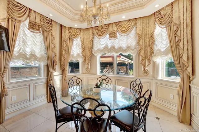 a view of a dining room with furniture and a window