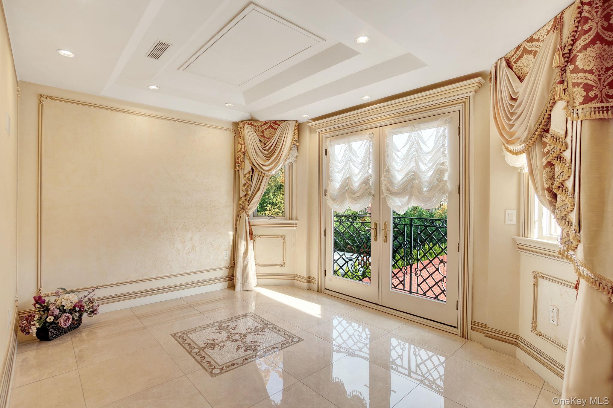181-30 Tudor Road Queens, NY 11432 - Photo 25 of 46 Doorway to outside featuring french doors, tile patterned floors, and recessed lighting