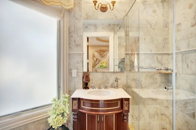a bathroom with a sink and shower