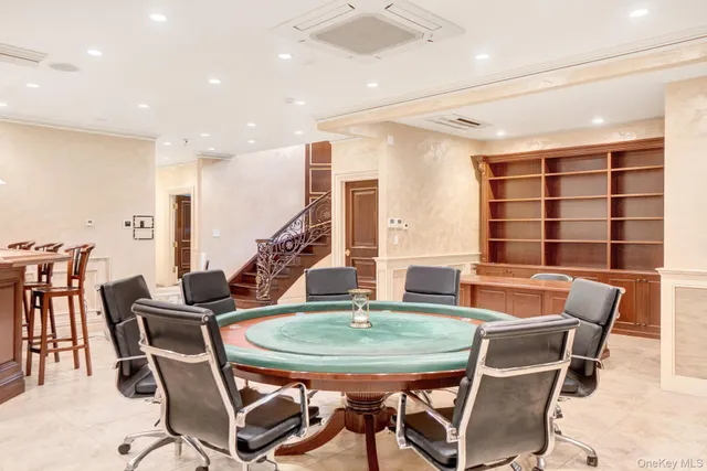 a dining room with furniture and window
