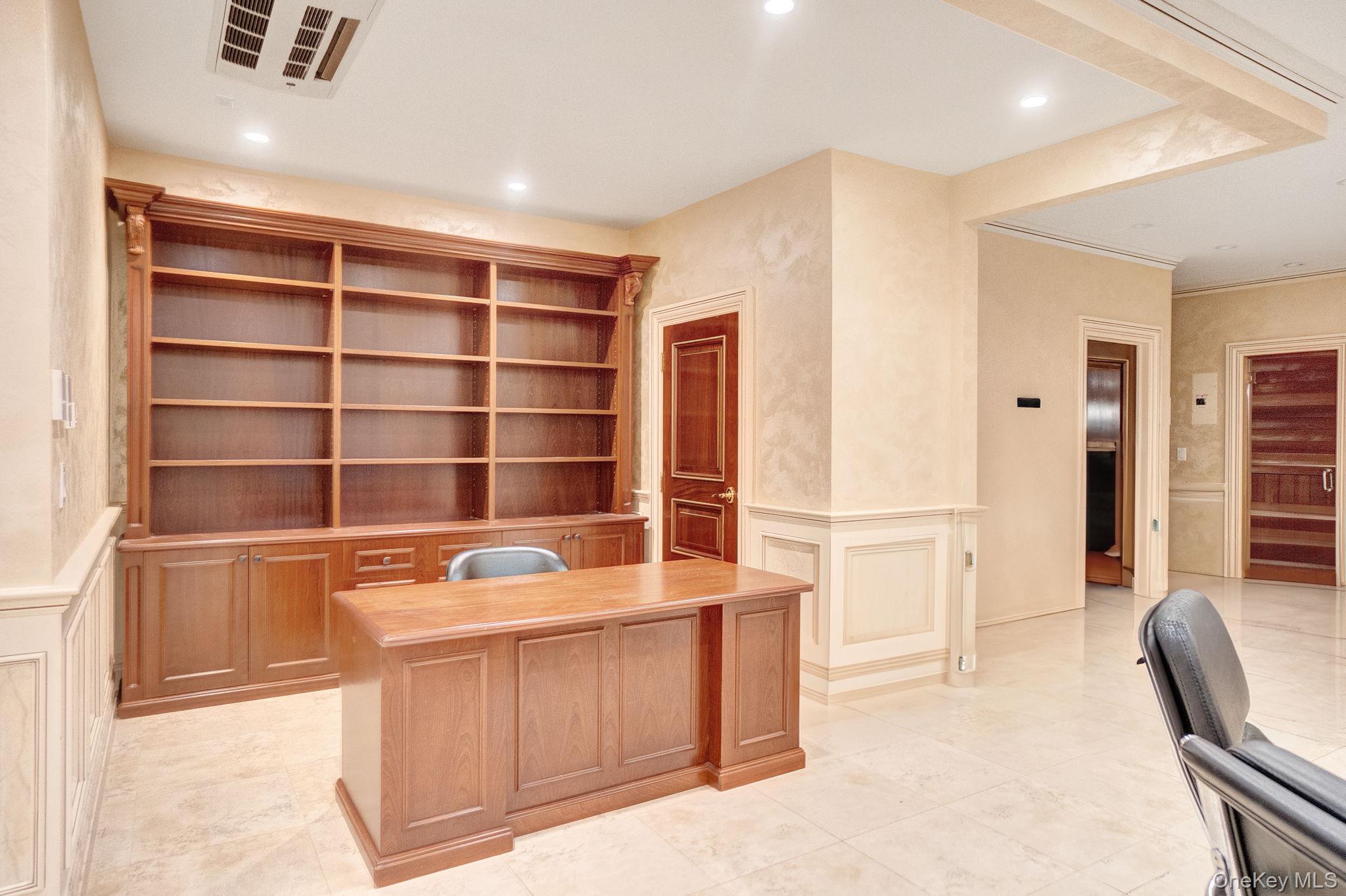 181-30 Tudor Road Queens, NY 11432 - Photo 33 of 46 Unfurnished office featuring a decorative wall, wainscoting, recessed lighting, and light tile patterned flooring