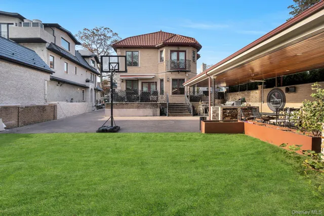 a view of a patio with a table and chairs