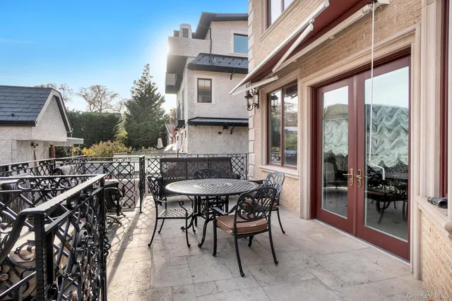 a patio with tables and chairs