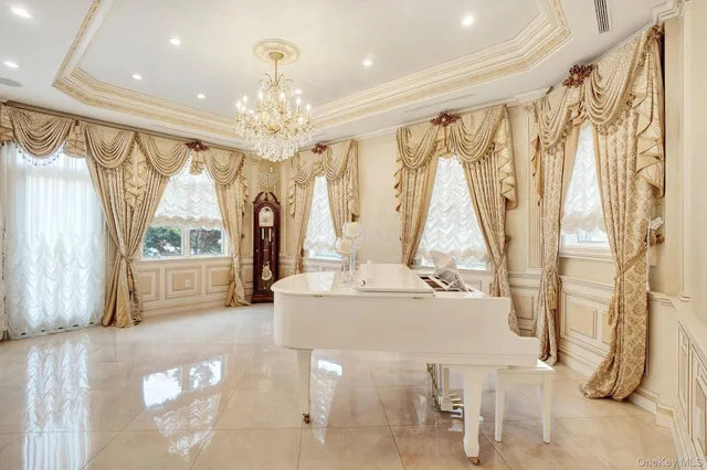 a large white kitchen with a large window