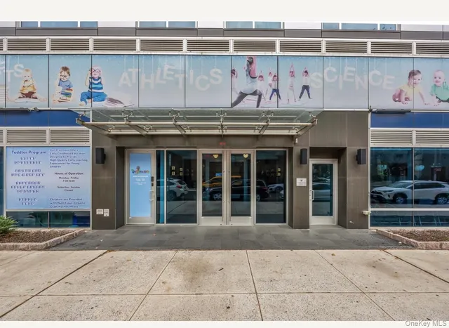 a front view of a building with glass windows