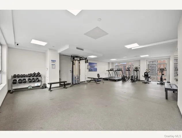 a view of a livingroom with furniture and a ceiling fan