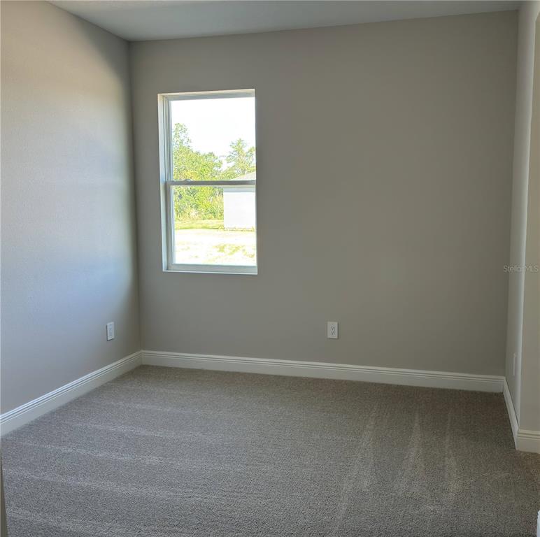 10037 Hidden Hammock Loop Parrish, FL 34221 - Photo 11 of 19 an empty room with a window