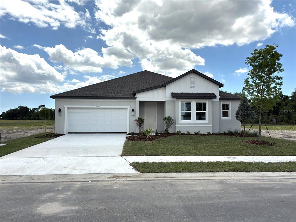 10037 Hidden Hammock Loop Parrish, FL 34221 - Photo 3 of 19 a front view of a house with a yard