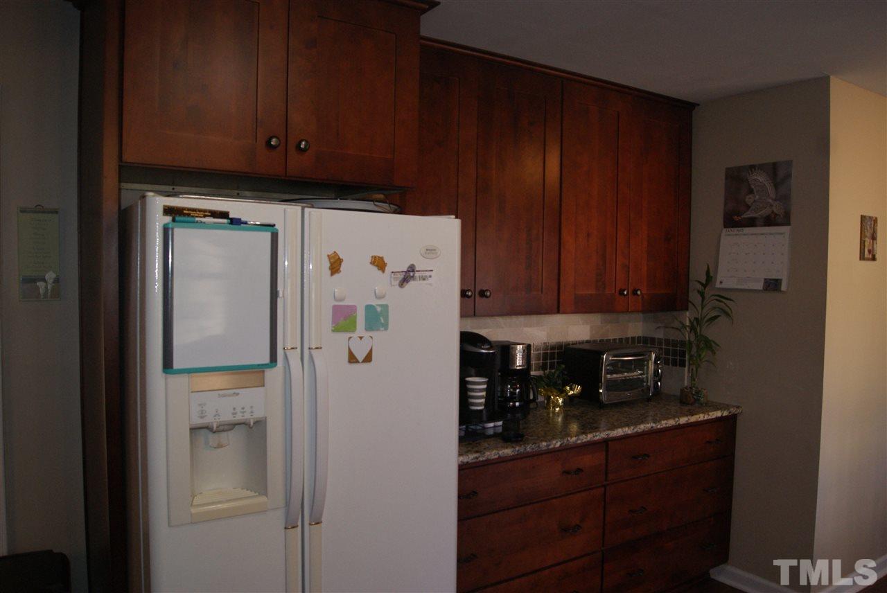 3209 Marie Drive Raleigh, NC 27604 - Photo 12 of 25 a kitchen with stainless steel appliances granite countertop a refrigerator and a cabinets