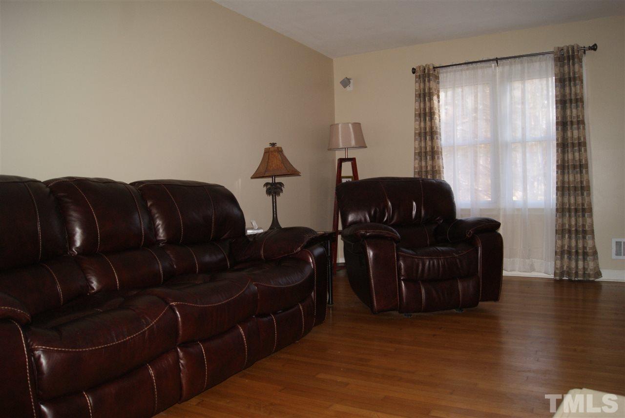 3209 Marie Drive Raleigh, NC 27604 - Photo 14 of 25 a living room with furniture and wooden floor