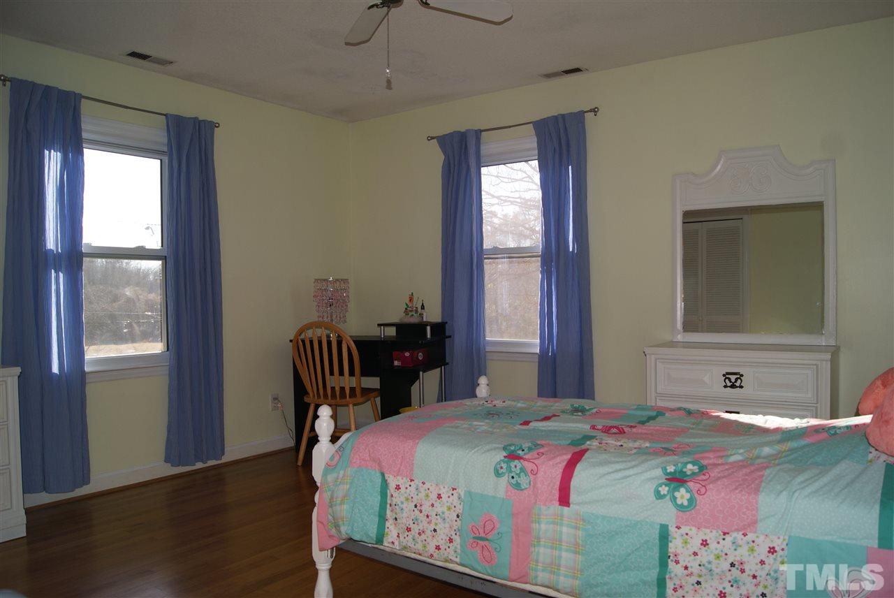 3209 Marie Drive Raleigh, NC 27604 - Photo 18 of 25 a bedroom with a bed and a window