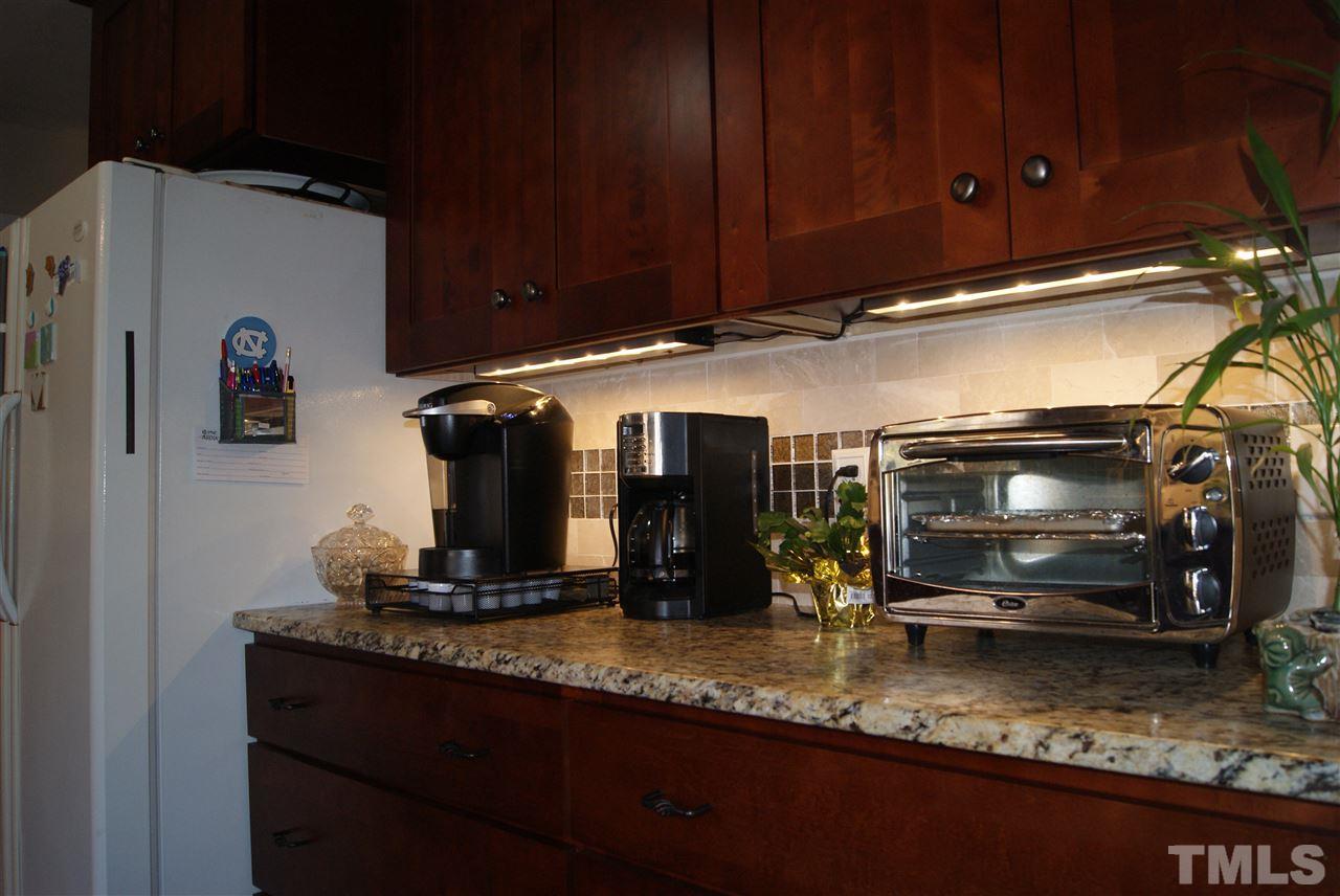 3209 Marie Drive Raleigh, NC 27604 - Photo 22 of 25 a kitchen with a refrigerator and cabinets