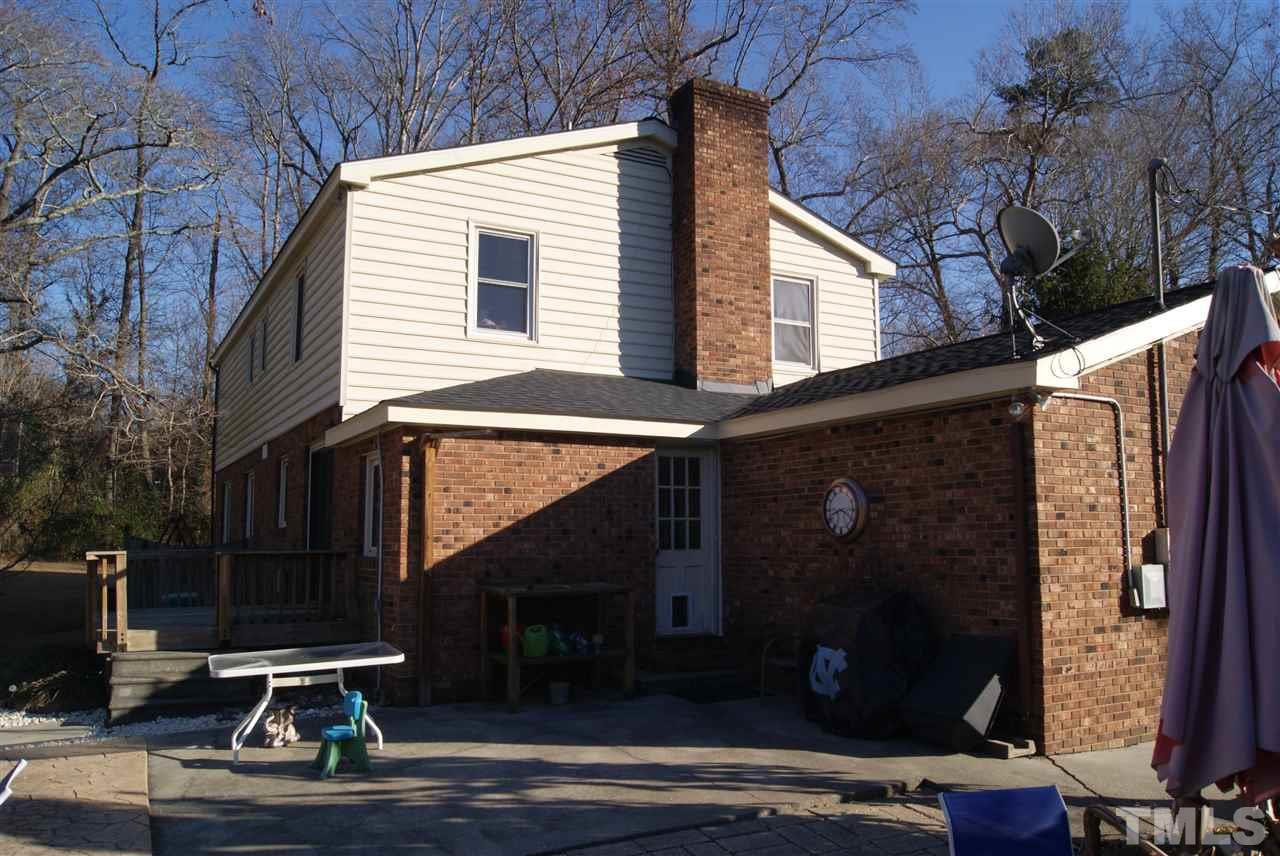 3209 Marie Drive Raleigh, NC 27604 - Photo 5 of 25 a view of backyard with wheel chair potted plants and large tree