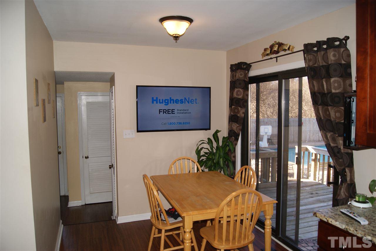 3209 Marie Drive Raleigh, NC 27604 - Photo 9 of 25 a view of a dining room with furniture and a potted plant