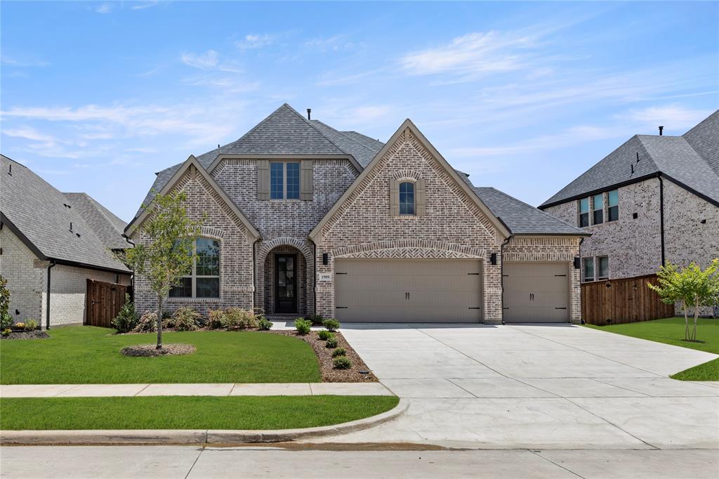 1909 Paxton Pass McKinney, TX 75071 - Photo 1 of 1 a front view of a house with a garden