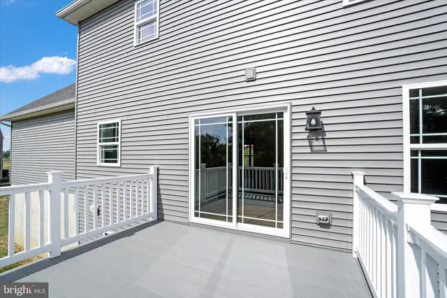 a kitchen with granite countertop a stove top oven sink and cabinets
