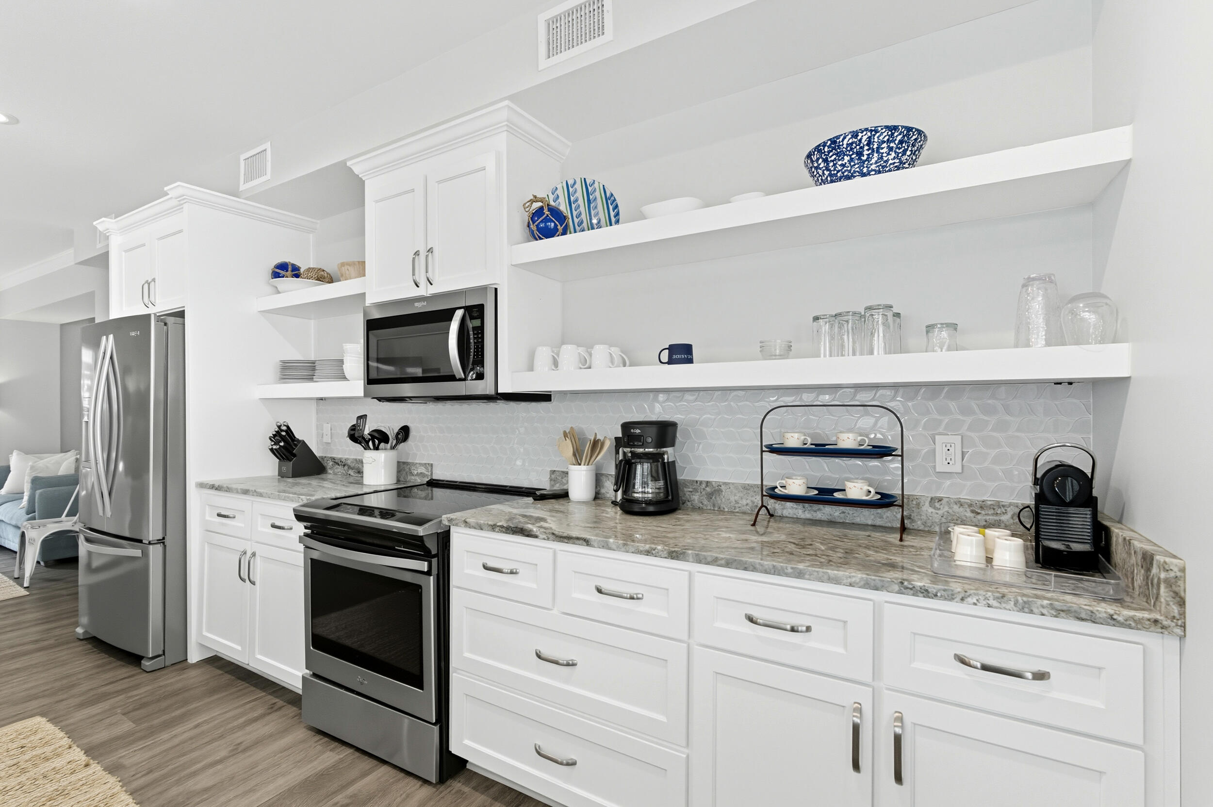 144 Hickory Street Santa Rosa Beach, FL 32459 - Photo 15 of 60 a kitchen with granite countertop cabinets and stainless steel appliances