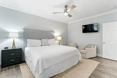 a bedroom with furniture and a window