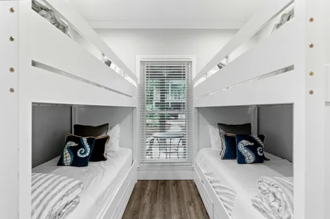 a bedroom with a bed and flat screen tv