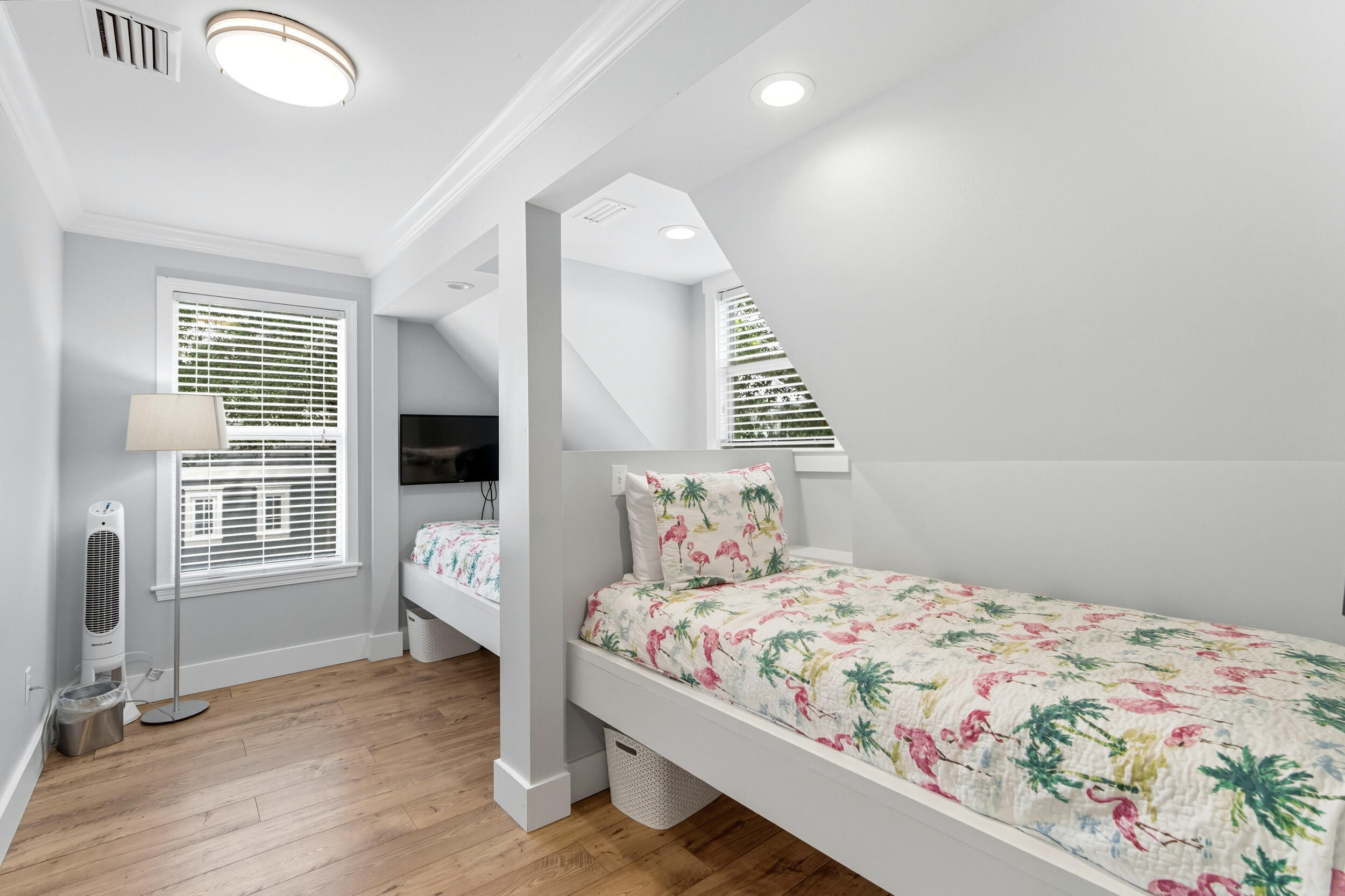 144 Hickory Street Santa Rosa Beach, FL 32459 - Photo 28 of 60 a bedroom with a bed a table and flat screen tv