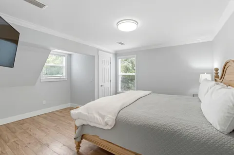a bathroom with a granite countertop sink mirror and vanity