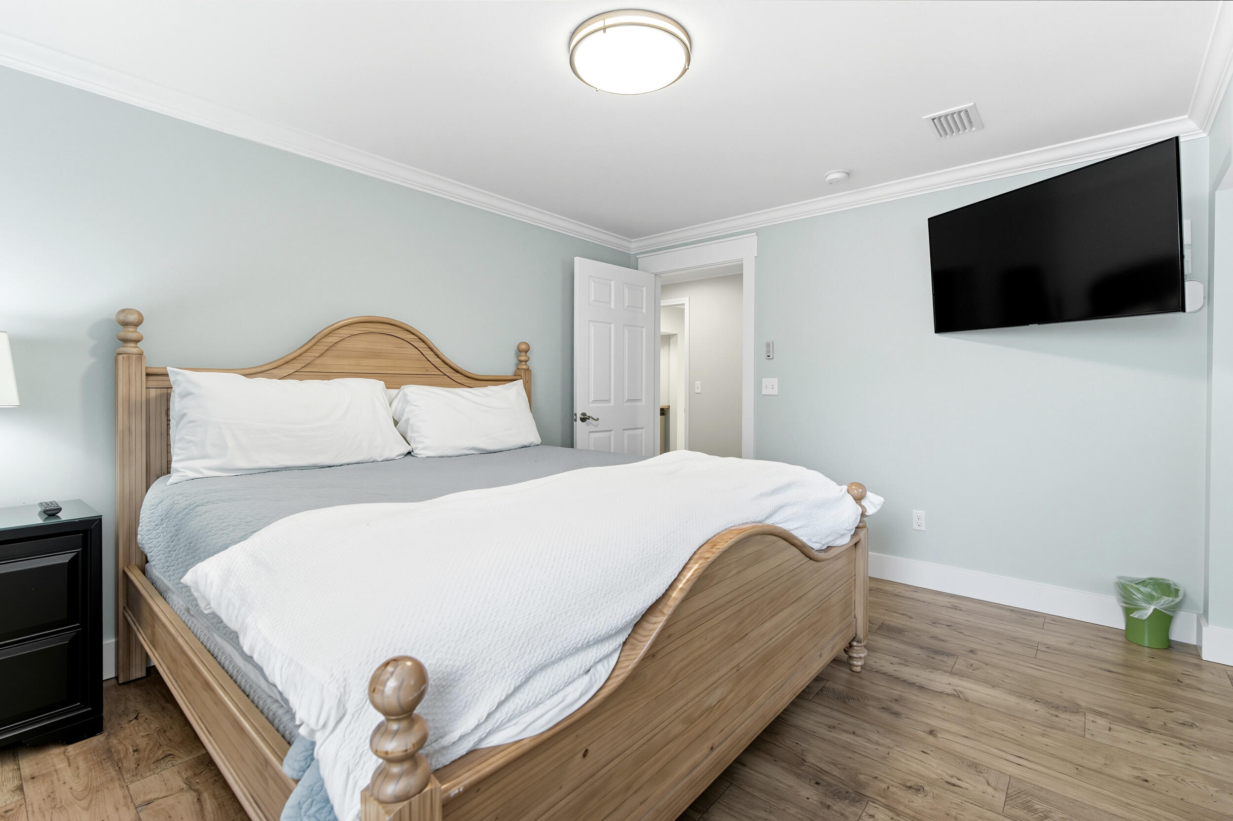 144 Hickory Street Santa Rosa Beach, FL 32459 - Photo 31 of 60 a bedroom with a bed and a flat screen tv