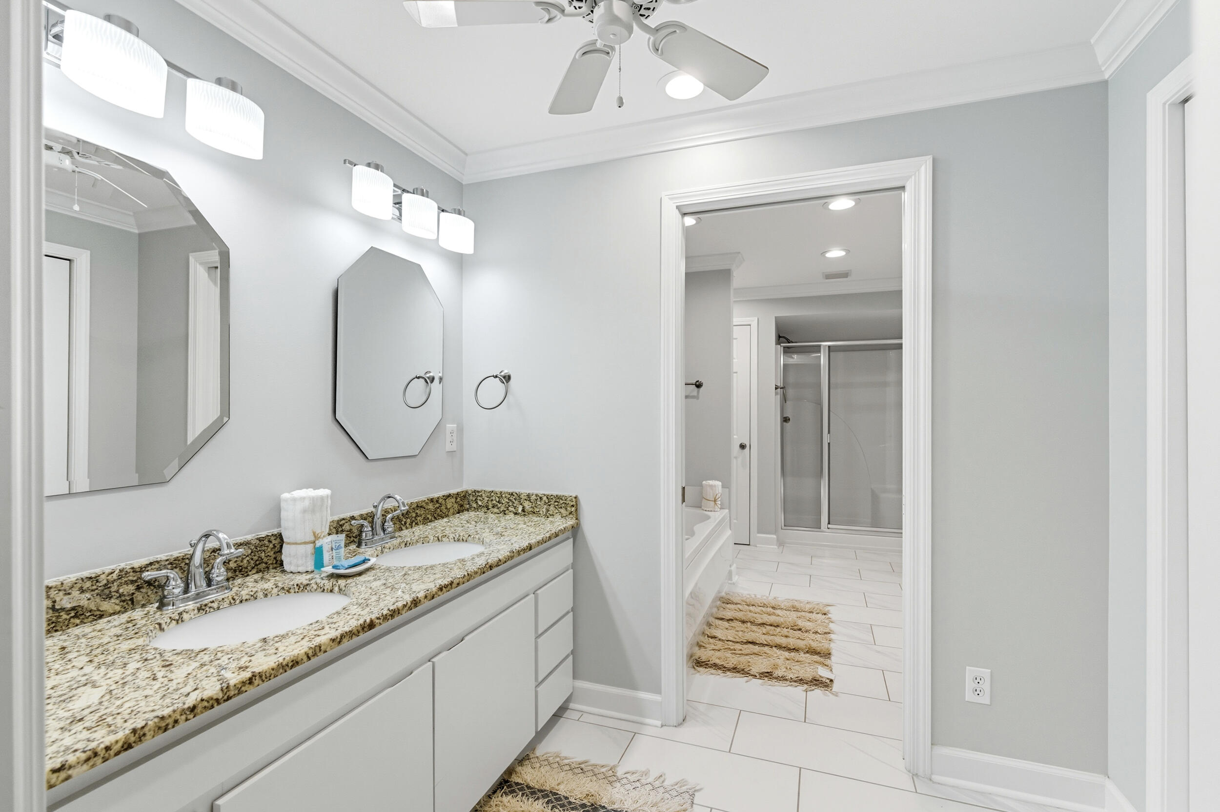 144 Hickory Street Santa Rosa Beach, FL 32459 - Photo 33 of 60 a bathroom with a granite countertop sink mirror and vanity