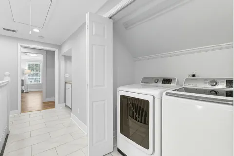 a view of a backyard with a chair and tables