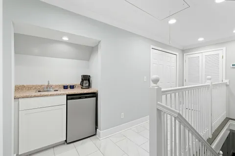 a view of backyard of house with green space