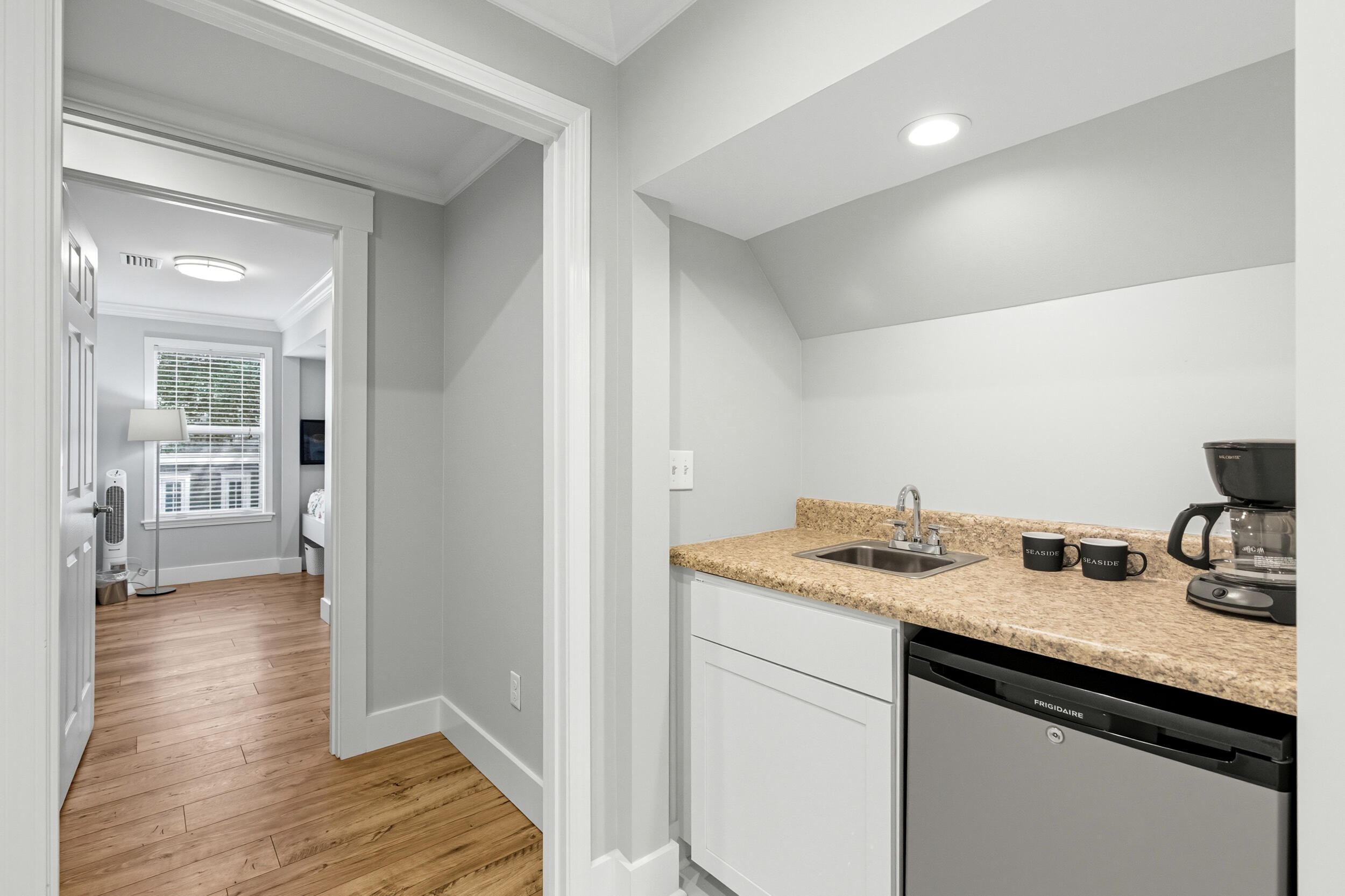 144 Hickory Street Santa Rosa Beach, FL 32459 - Photo 39 of 60 a hallway with sink and mirror