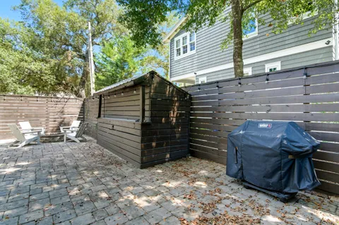 a view of house with backyard and seating area