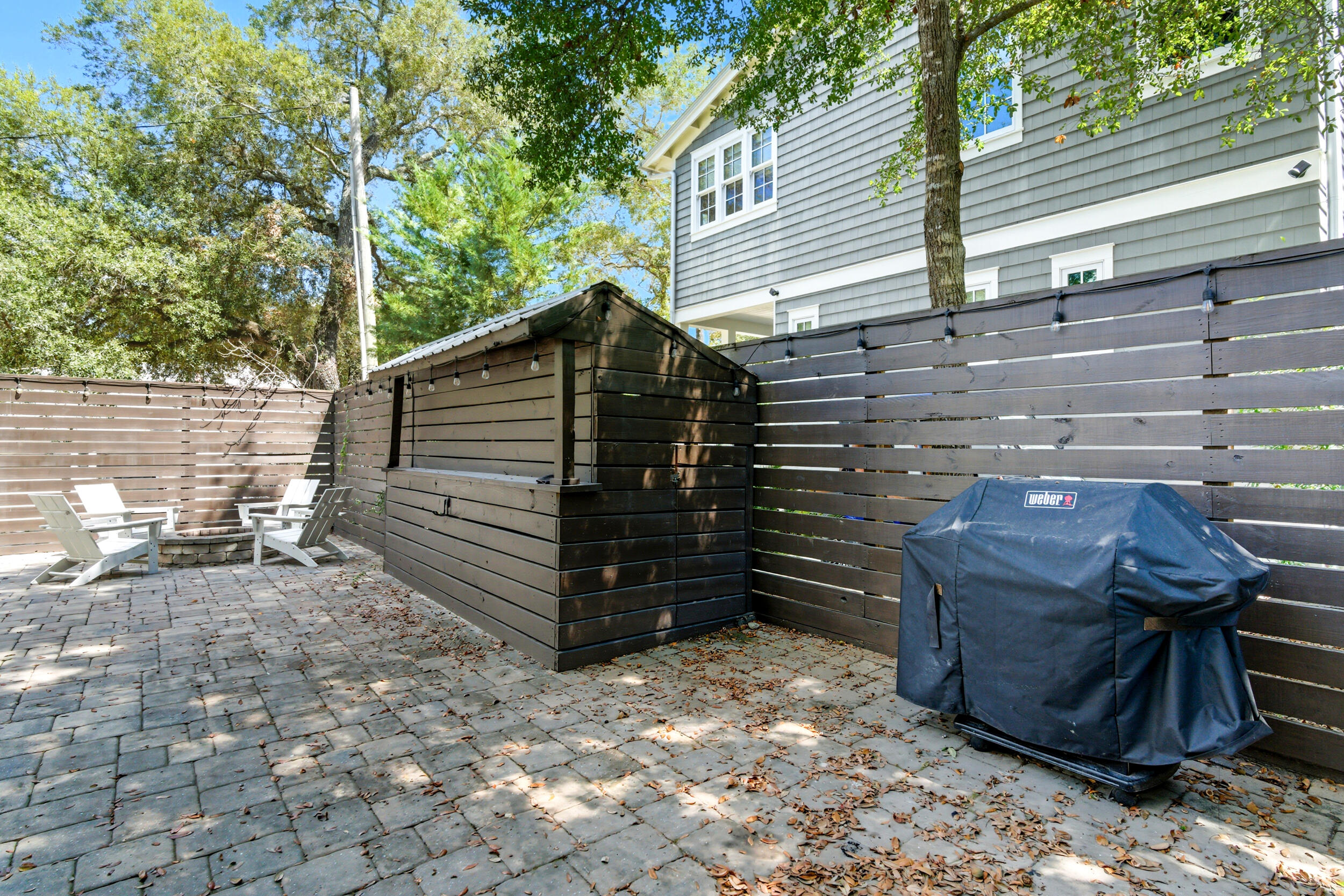 144 Hickory Street Santa Rosa Beach, FL 32459 - Photo 40 of 60 a view of a backyard with a chair and tables